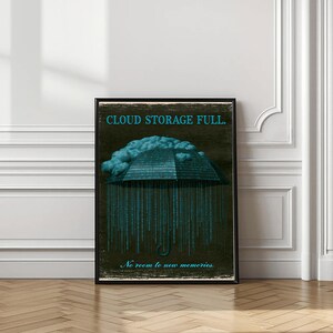 Full-length vertical poster in a wood frame standing on the floor with a vase at left. Shows the cyan binary umbrella and falling 1s and 0s down the dark background; the script line at the bottom is visible.