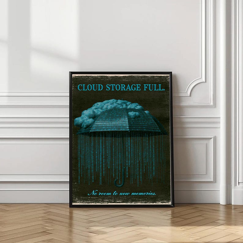 Full-length vertical poster in a wood frame standing on the floor with a vase at left. Shows the cyan binary umbrella and falling 1s and 0s down the dark background; the script line at the bottom is visible.