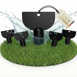 May include: A black bottle stopper set with a tag that says "MADE IN GERMANY". The set includes a large stopper and four smaller stoppers, all on a bed of green grass. Water droplets are splashing around the stoppers.