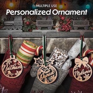 May include: Three personalised wooden Christmas ornaments with the names "Nathan", "Daniel", and "Melanie" hanging from stockings. The ornaments are in the shape of a ball with snowflakes and other festive designs.