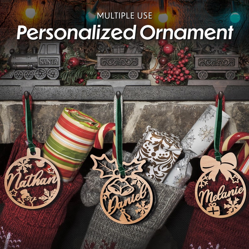 May include: Three personalised wooden Christmas ornaments with the names "Nathan", "Daniel", and "Melanie" hanging from stockings. The ornaments are in the shape of a ball with snowflakes and other festive designs.