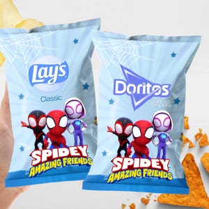 May include: Two bags of Lay's Classic and Doritos Nacho Cheese chips featuring the Spidey and His Amazing Friends characters. The bags are light blue with star and web designs. The chips are in the shape of triangles and are orange.
