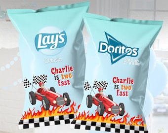 May include: Two light blue snack bags featuring the Lay's Classic and Doritos Nacho Cheese logos. Each bag displays a red race car, a checkered flag, orange flames, and the text Charlie is two fast in red and orange lettering.