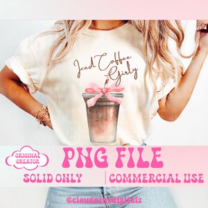 May include: A white t-shirt with the text "Iced Coffee Girly" in brown script. A pink bow is tied around a brown iced coffee cup with a straw. The text "PNG FILE" is in pink letters with a wavy outline. The text "SOLID ONLY" and "COMMERCIAL USE" are below the PNG FILE text.