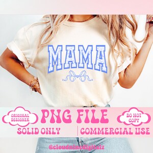 May include: A white t-shirt with a blue "MAMA" graphic and a blue bow. The text "PNG FILE" is in pink letters with a pink cloud on either side. The text "SOLID ONLY" and "COMMERCIAL USE" are below the pink text. The text "ORIGINAL DESIGNER" is in a white cloud with a black outline. The text "DO NOT COPY" is in a white cloud with a black outline.