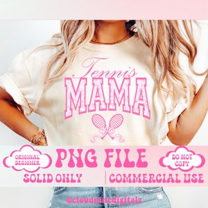 May include: A pink and white graphic design on a cream t-shirt that says "Tennis Mama" with two pink tennis rackets and a bow. The text "PNG File" is in pink with a retro font. The text "Solid Only" and "Commercial Use" are also in pink.
