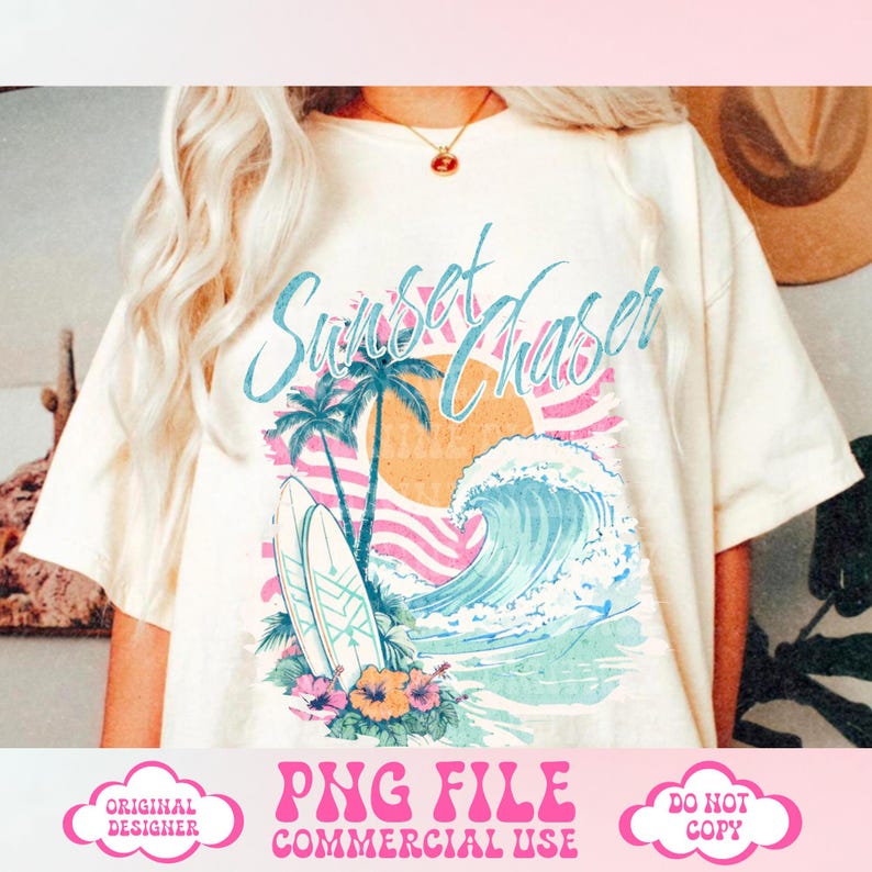 May include: A white t-shirt with a graphic design of a sunset, palm trees, and a wave with surfboards. The text "Sunset Chaser" is written in a stylized font.