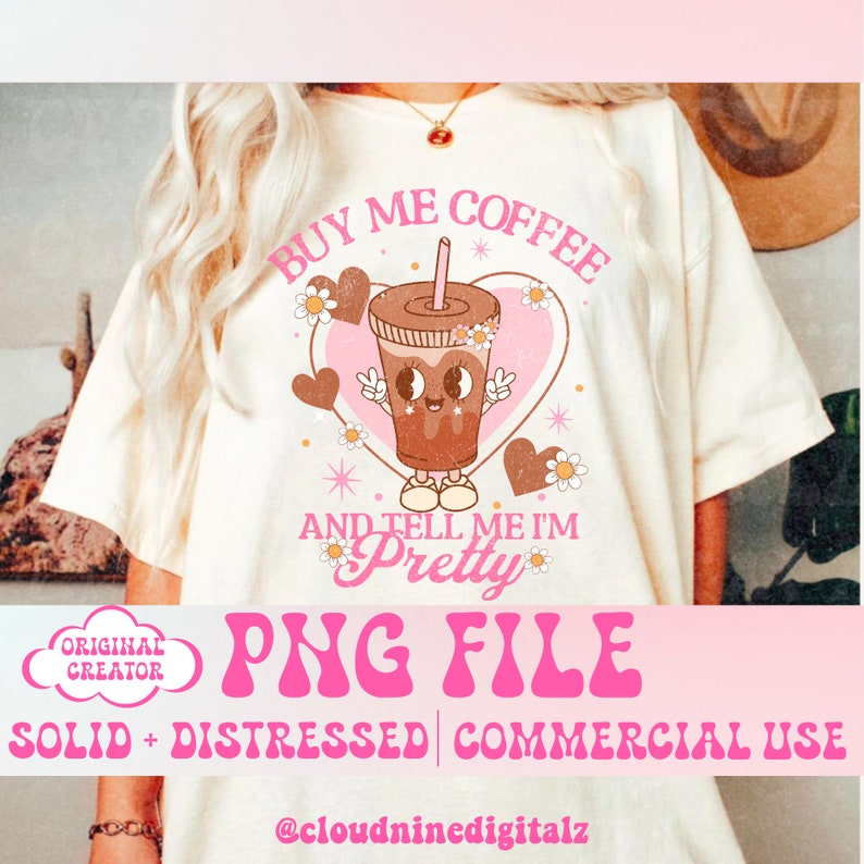 May include: A white t-shirt with a pink graphic design featuring a cartoon coffee cup with the text "Buy me coffee and tell me I'm pretty".
