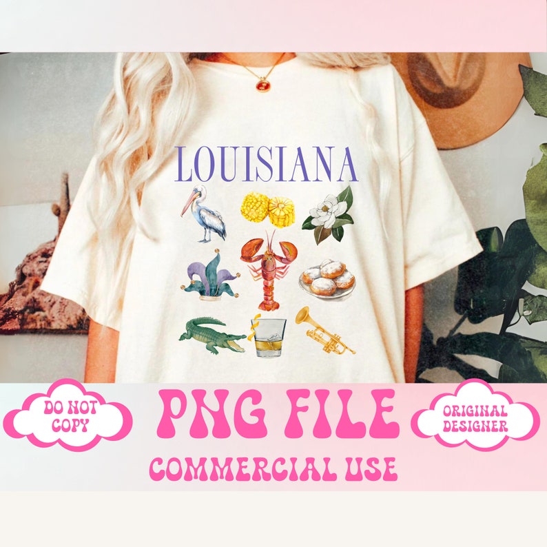 May include: A white t-shirt with the word "LOUISIANA" printed in purple letters. The shirt features a variety of watercolor illustrations of Louisiana symbols, including a pelican, a crawfish, a fleur-de-lis, a glass of whiskey, a trumpet, and beignets. The text "PNG FILE COMMERCIAL USE" is printed in pink letters below the image.
