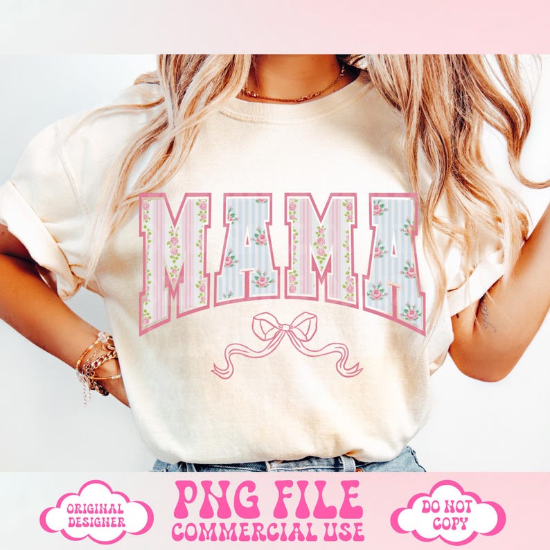 May include: A white t-shirt with the word "MAMA" printed in pink letters with a floral pattern. The letters are outlined in pink and have a vintage look. A pink bow is below the word "MAMA".