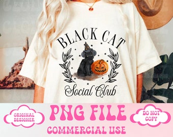 May include: A white t-shirt with a black cat wearing a witch hat and holding a pumpkin. The text "Black Cat Social Club" is printed on the shirt.