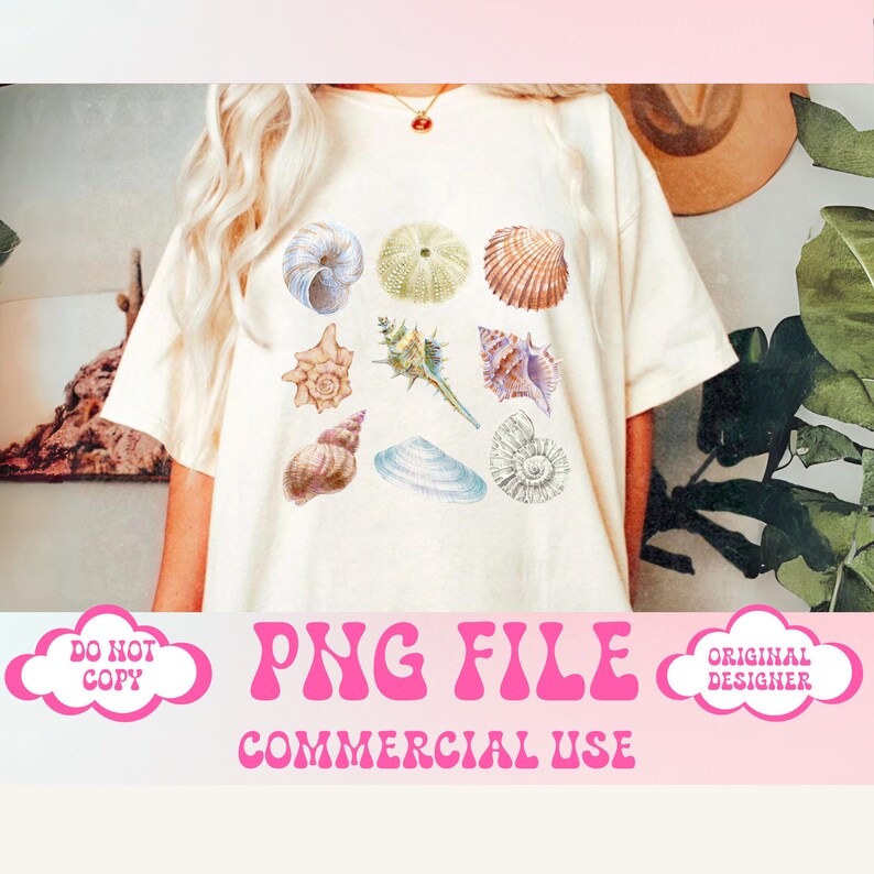 May include: A white t-shirt with a design of various seashells in different colors and shapes. The text "PNG FILE COMMERCIAL USE" is printed below the design.