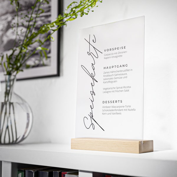 Personalized wedding menu - acrylic glass with individual dishes on a wooden stand