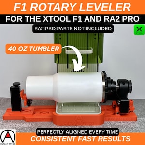 May include: An orange and black rotary leveler for the Xtool F1 and RA2 Pro laser engraver. A white 40 oz tumbler is positioned in the center. The text reads "Perfectly Aligned Every Time" and "Consistent Fast Results".