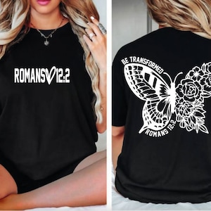 May include: Black t-shirt with white text "ROMANS&hearts;12:2" on the front and a white butterfly with flowers and the text "BE TRANSFORMED ROMANS 12:2" on the back.