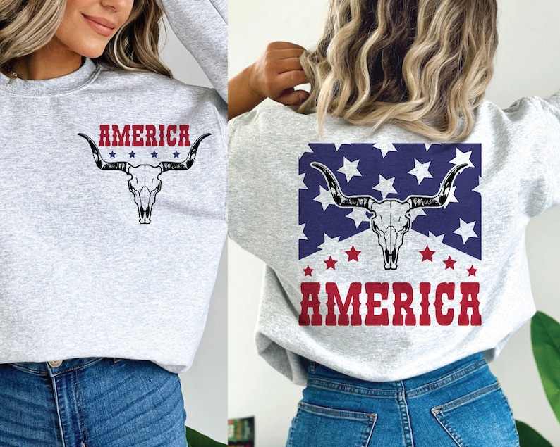 May include: Two gray sweatshirts with a skull and crossbones design and the word "AMERICA" printed on them. The skull and crossbones are in a red, white, and blue color scheme.
