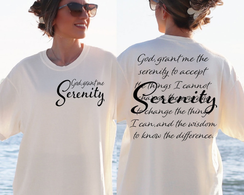 May include: White t-shirt with black text that reads "God, grant me the serenity to accept the things I cannot change, the serenity to change the things I can, and the wisdom to know the difference."