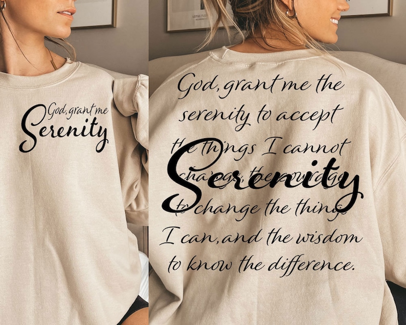 May include: A beige sweatshirt with the text "God, grant me the serenity to accept the things I cannot change, serenity to change the things I can, and the wisdom to know the difference." printed on the back.