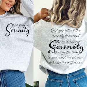 May include: A gray sweatshirt with the text "God, grant me Serenity" on the front and "God, grant me the serenity to accept the things I cannot change, Serenity to change the things I can, and the wisdom to know the difference." on the back.