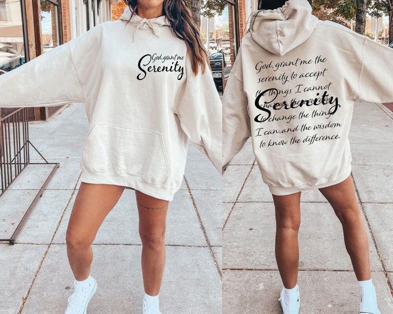 May include: A beige hoodie with the text "God grant me the serenity to accept the things I cannot change, the serenity to change the things I can, and the wisdom to know the difference." printed on the back.