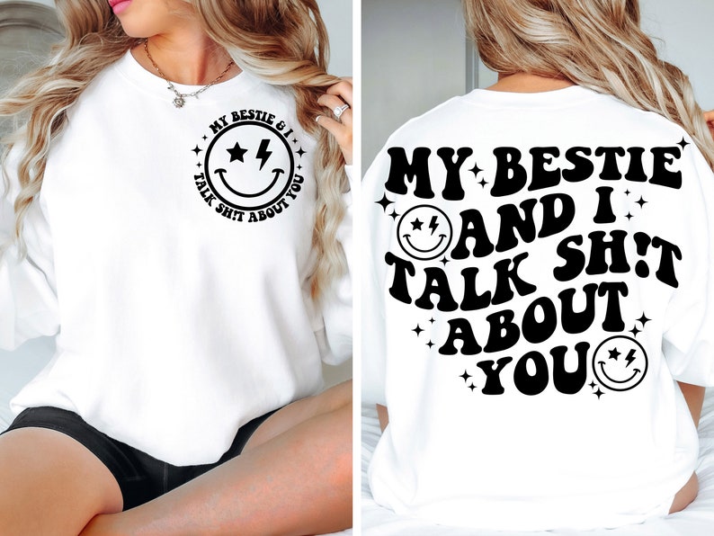 May include: White sweatshirt with black text that reads "My bestie and I talk shit about you" with a smiley face graphic. The text is in a retro font style.