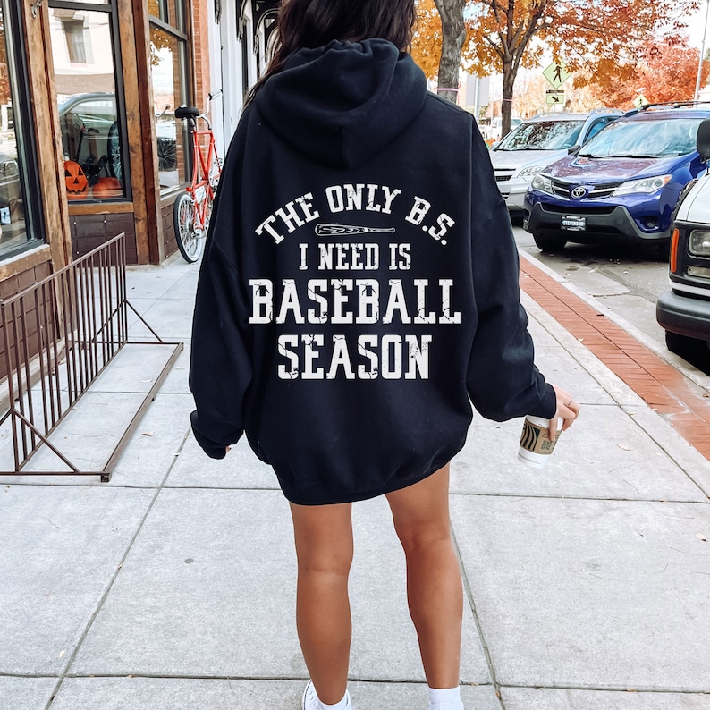 May include: Black hooded sweatshirt with white text that reads "The only B.S. I need is baseball season" with a baseball bat graphic.