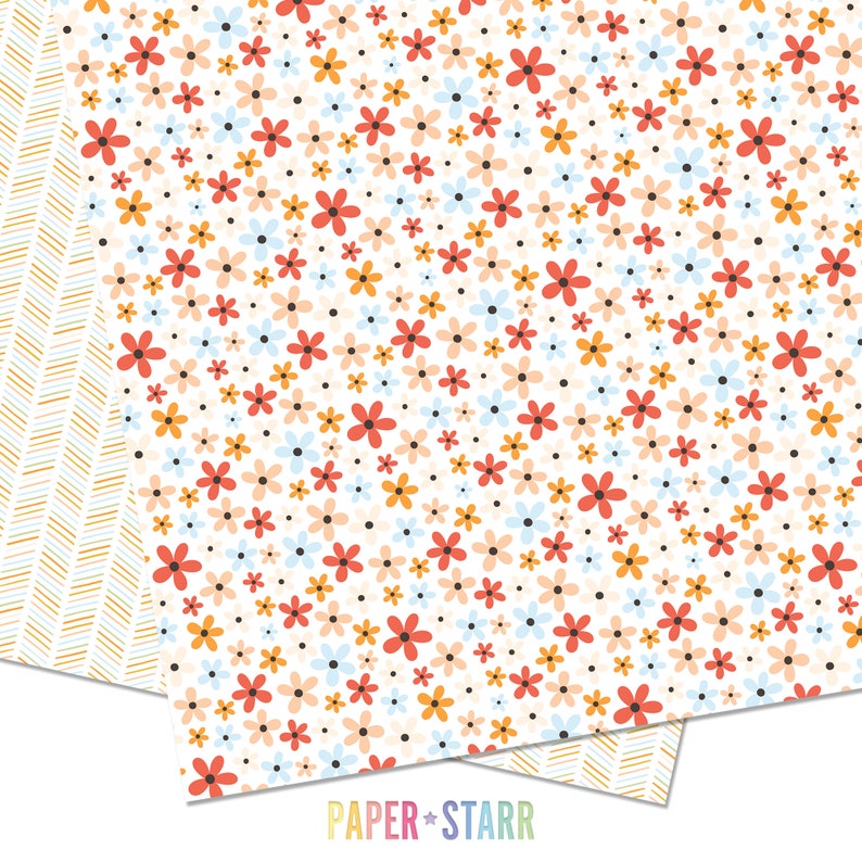 May include: A white background with a repeating pattern of small, colorful flowers. The flowers are in shades of red, orange, yellow, blue, and pink. The background is dotted with small black dots.