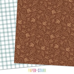 May include: A seamless pattern featuring a brown background with a white outline of leaves, acorns, and small stars. The pattern is perfect for fall-themed crafts and projects.