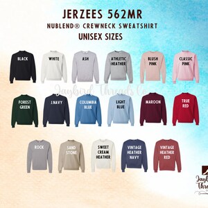 May include: A display of Jerzees 562MR NuBlend crewneck sweatshirts in various colors, including black, white, and pink. The image shows the available colors with the name of each color printed on the sweatshirt. The text "UNISEX SIZES" is also visible.