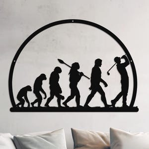 May include: Black metal wall art depicting the evolution of man, culminating in a golfer swinging a club. The art is mounted on a white wall above a white couch.
