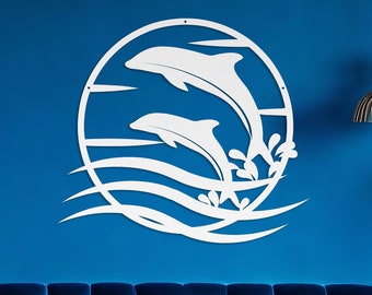 May include: White metal wall art featuring two dolphins jumping out of the water with waves and seaweed. The art is mounted on a blue wall above a blue velvet sofa.