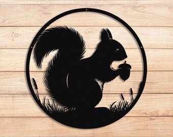 May include: Black metal silhouette of a squirrel holding an acorn, surrounded by grass, in a circular frame.