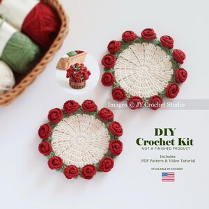 May include: Two crochet coasters with red rose accents and a cream-colored center. The coasters are part of a DIY crochet kit, including a PDF pattern and video tutorial. The image also shows a small basket of crochet roses.