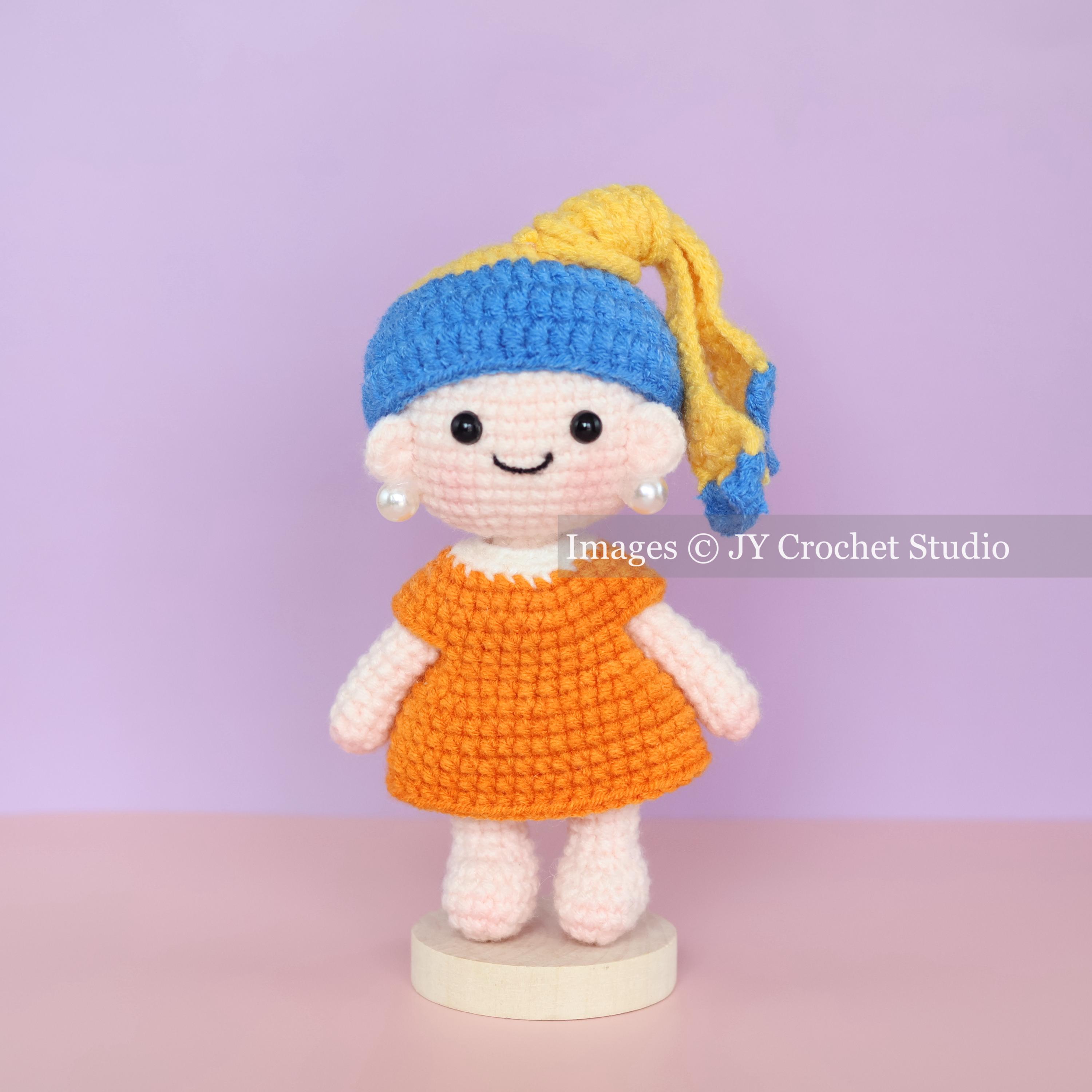 Art-Inspired Crochet Doll with Pearl Earring – Handmade Amigurumi Girl with Display Stand, Orange Dress Gift, Crochet Girl Doll