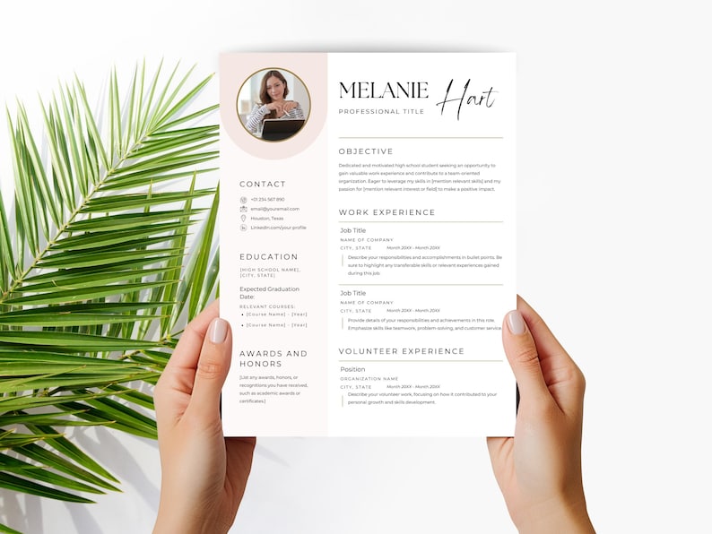May include: A white resume template with a soft pink circular photo frame at the top left. The document features sections for contact, education, awards, objective, work experience, and volunteer experience with black text and lines.
