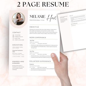 May include: A two-page resume template featuring a clean white layout with soft pink accents. The document includes sections for contact information, education, objective, work experience, volunteer experience, skills, and references.