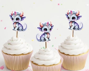 May include: Three cupcakes with purple and pink dragon toppers. The cupcakes are frosted with white frosting and have pink cupcake liners.