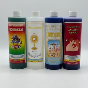 May include: Four clear glass bottles with blue, green, white, and purple liquid. Each bottle has a label with Spanish text and an image. The labels read "Agua Espiritual Potencias", "Agua Bendita", "Agua Espiritual Justo Juez", and "Agua Espiritual Amasa Guapo".