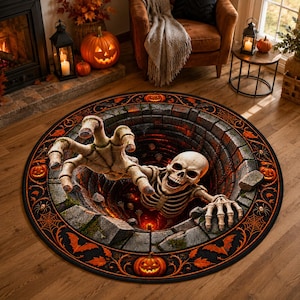 May include: A round area rug featuring a 3D optical illusion of a stone well with a skeleton emerging from the center. The border is decorated with orange pumpkins, spiderwebs, and bats on a black background, creating a spooky Halloween theme.