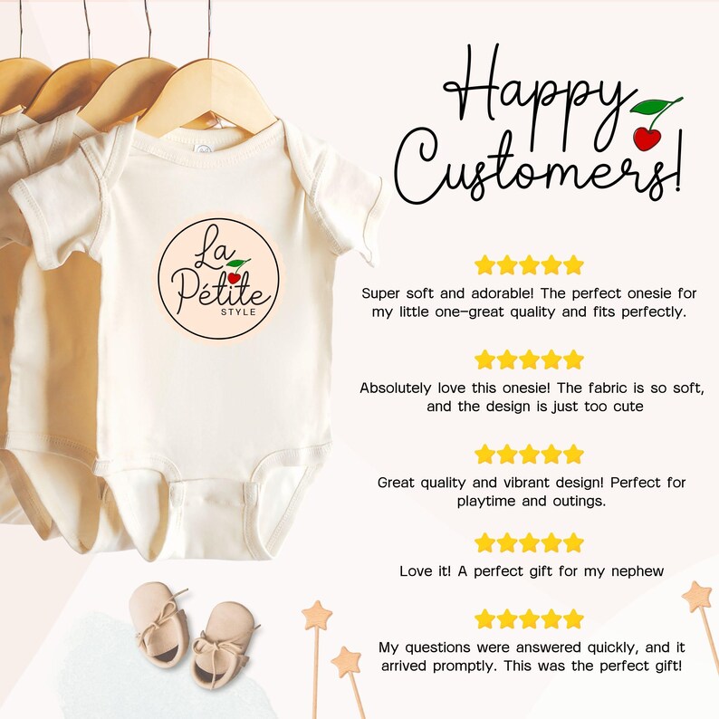 May include: A white onesie with a red cherry and the text "La Petite Style" in a black circle. The onesie is hanging on a clothes hanger. The image includes customer reviews praising the quality and softness of the onesie.
