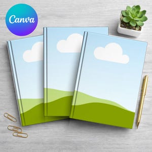 May include: Three notebooks with a landscape design featuring a blue sky, white cloud, and green hills. A gold pen, paper clips, and a small potted succulent are also present. The Canva logo is in the upper left corner.