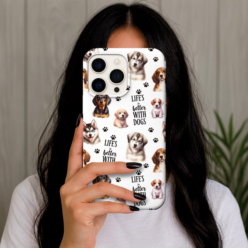 May include: White phone case featuring a collage of various dog breeds, paw prints, and the text "Life's better with dogs." The case showcases a variety of puppies, including a husky, beagle, and dachshund.