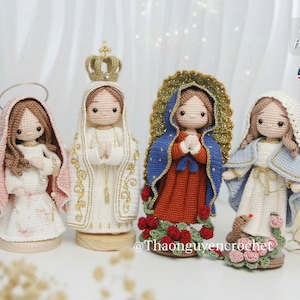 May include: Four handmade crochet figures of religious figures. Each figure is dressed in different coloured robes and head coverings. The figures are adorned with gold crowns and halos. The image includes the text "PDF Pattern" and the American flag.