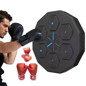 May include: A black, octagonal boxing training target with blue detailing. The target features six hexagonal pads and a central speaker. A person wearing black boxing gloves is shown practicing punches. Red boxing gloves with gold designs are also visible.
