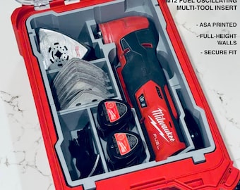 May include: A red and gray custom Packout organizer with a clear lid, containing a M12 Fuel oscillating multi-tool, blades, and accessories. The text on the organizer reads "CUSTOM PACKOUT ORGANIZER" and "M12 FUEL OSCILLATING MULTI-TOOL INSERT".