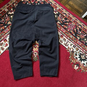 May include: A trio of ceramic mugs with a speckled, matte finish in cream, light grey, and dark grey. Each mug features a simple, minimalist design, ideal for tea or coffee.