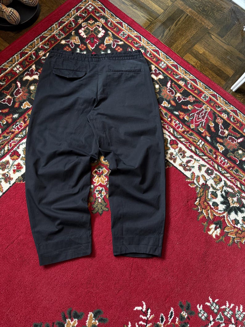 May include: A trio of ceramic mugs with a speckled, matte finish in cream, light grey, and dark grey. Each mug features a simple, minimalist design, ideal for tea or coffee.