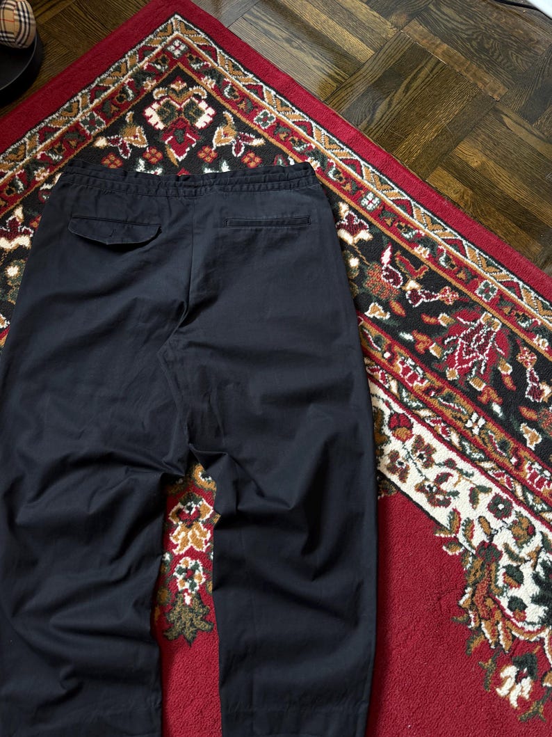 May include: A trio of ceramic mugs with a speckled, matte finish in cream, light grey, and dark grey. Each mug features a simple, modern design and a rounded handle. Ideal for tea or coffee.