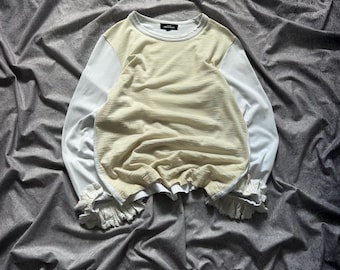 Tricot Comme Des Garcons gebroken witte dames T-shirt met ruches en lange mouwen