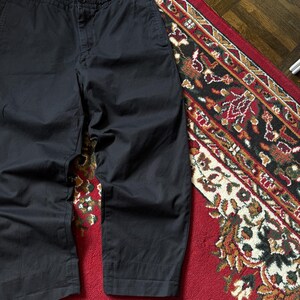 May include: Set of three ceramic mugs with a speckled, matte finish in cream, light grey, and dark grey. Each mug has a simple, minimalist design, suitable for coffee or tea.